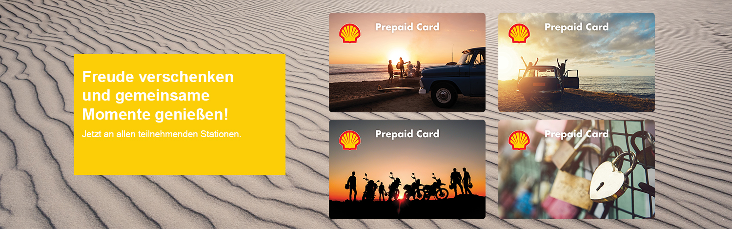 Die neuen Strandmotive der Shell Prepaid Card auf einer Sanddüne