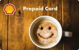 Shell Prepaid Card "Coffee Break" mit dem Motiv einer Kaffeetasse auf einem Holztisch.